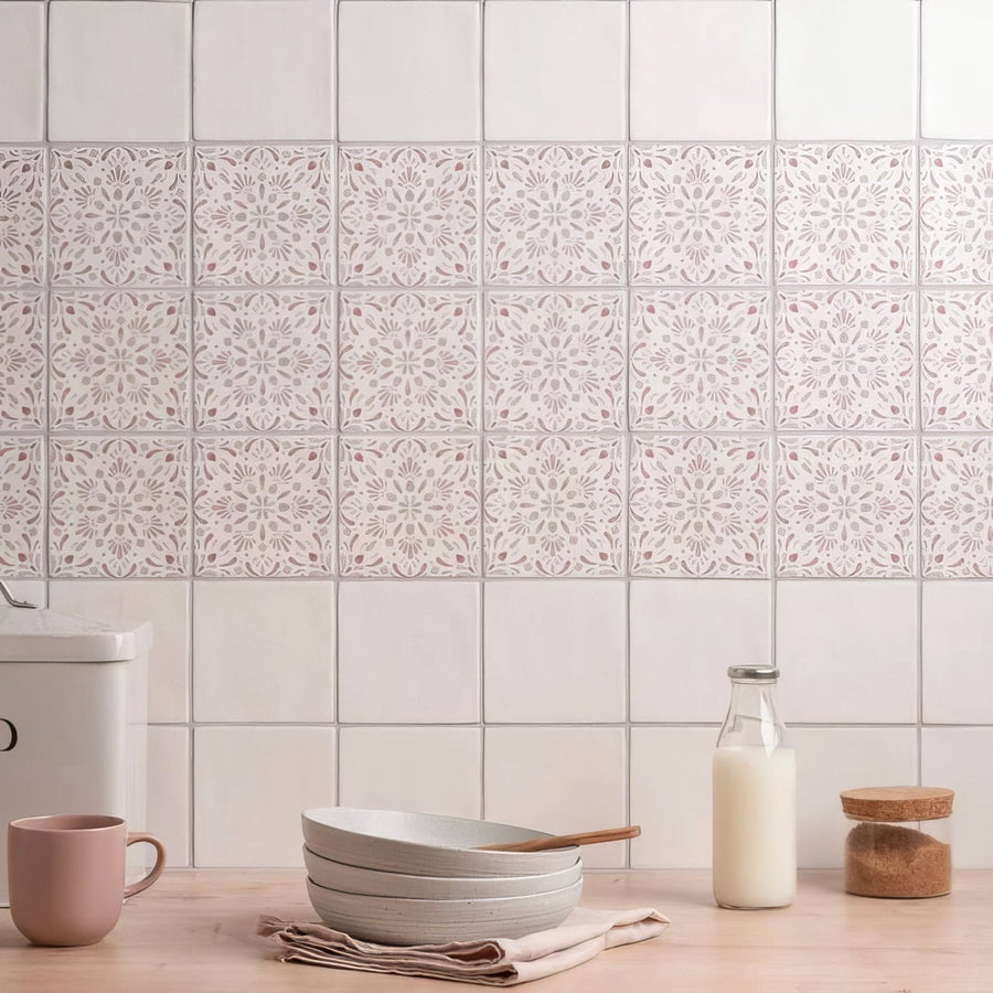 White ceramic frost field tile with delicate lace-like floral patterns used as a decorative backsplash