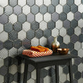 Futura Zirconia Hexagon Mosaic grey and white hexagon mosaic with a stack of orange striped towels