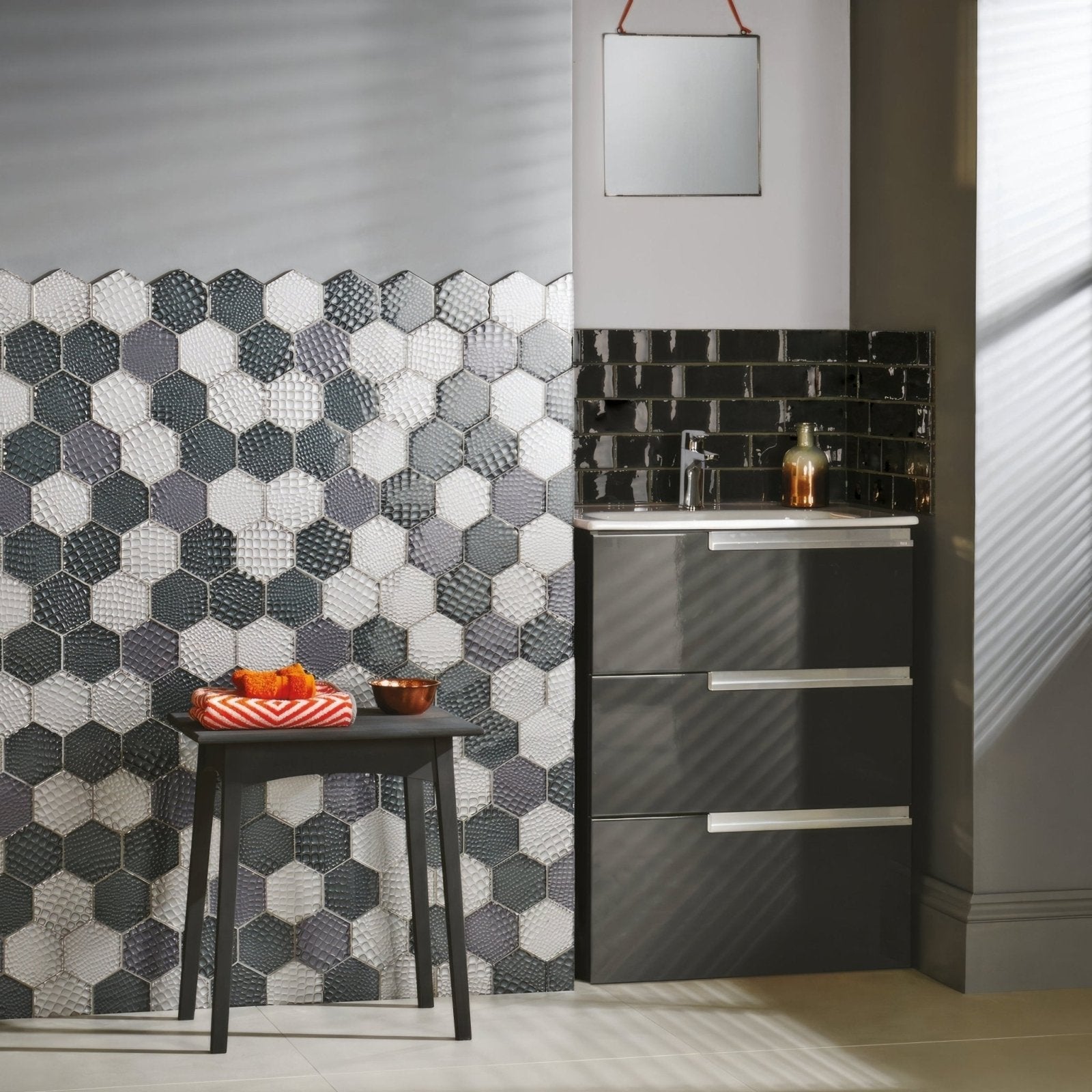 Futura zirconia hexagon mosaic tile wall with textured glossy finish in varying shades of gray and white