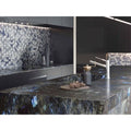 Future Sapphire Mosaic grey, navy and black hexagon mosaic with a dark granite kitchen island