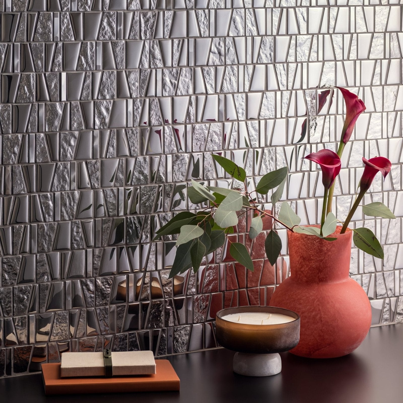 Galactic Mirror Mosaic silver mirrored glass and stone mosaic with a coral-orange ceramic vase