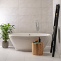Galana Gloss 1000 x 330mm white marble-effect tiles with a freestanding bathtub