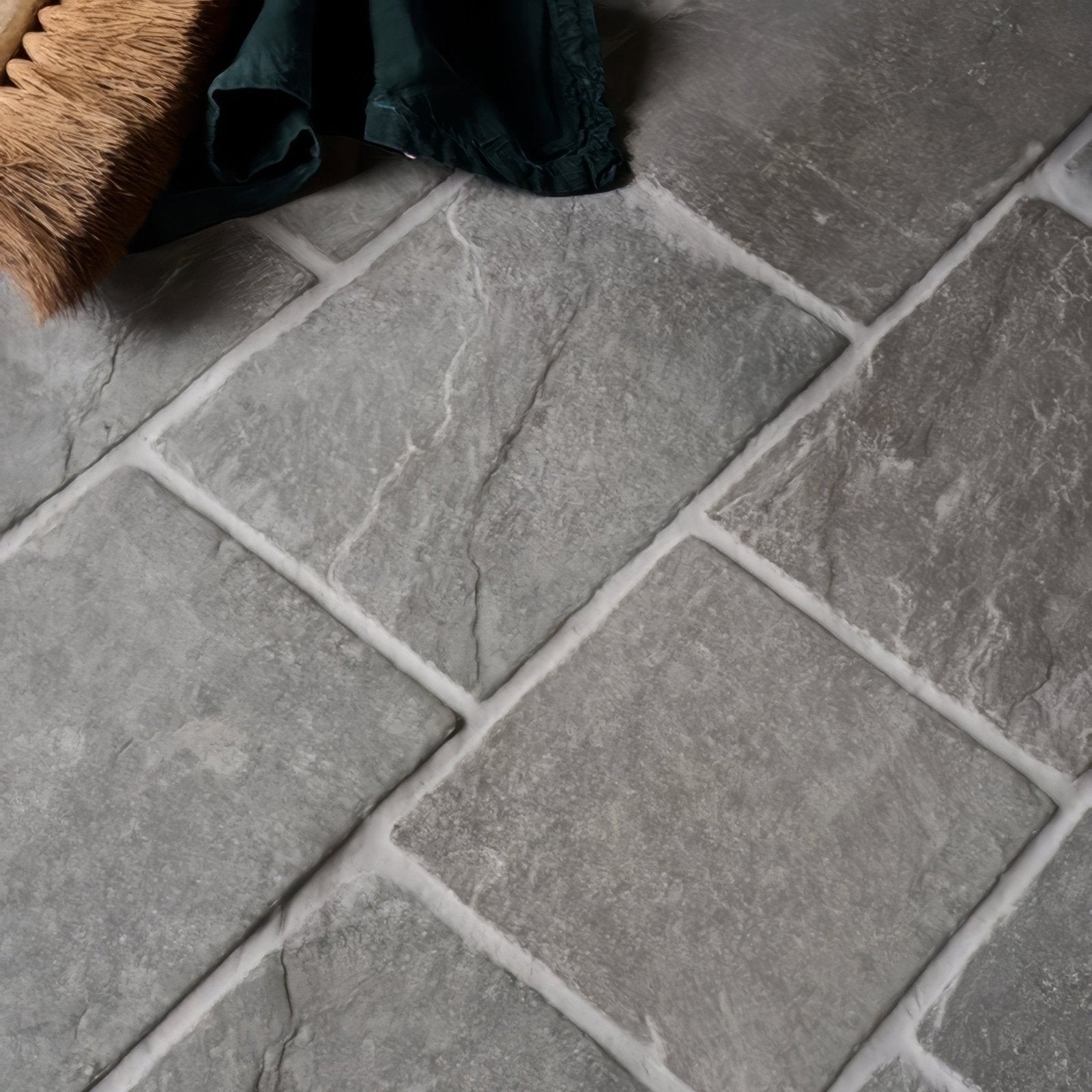 Gray stone-effect galway limestone cobble seasoned finish floor tiles with textured natural surface and white grout lines