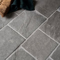Gray stone-effect galway limestone cobble seasoned finish floor tiles with textured natural surface and white grout lines