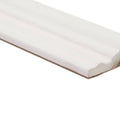 White ceramic baseboard molding giralda cascara cream dado with smooth glossy finish and subtle beveled edges