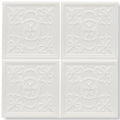White ceramic giralda cascara cream decor tile with raised ornate floral and scrollwork patterns