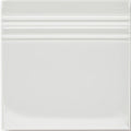 White ceramic giralda cascara cream skirting tile with a glossy finish and three horizontal ridges near the top