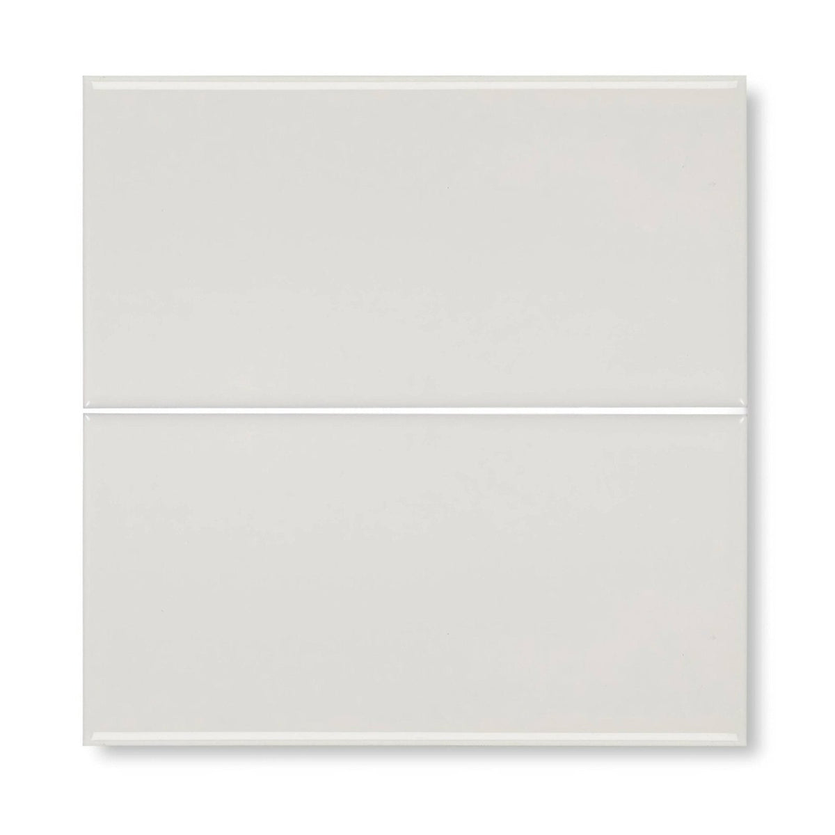Two glossy white rectangular glass tiles stacked vertically from Giralda cascara cream tile collection