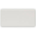 A sleek rectangular white ceramic tile with a smooth glossy finish giralda cascara cream tile