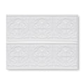 White ceramic subway tile giralda hielo white border with raised ornate floral patterns for wall decor