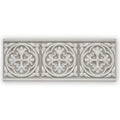 A rectangular off-white ceramic tile giralda niebla grey border with three raised floral medallions and leafy patterns