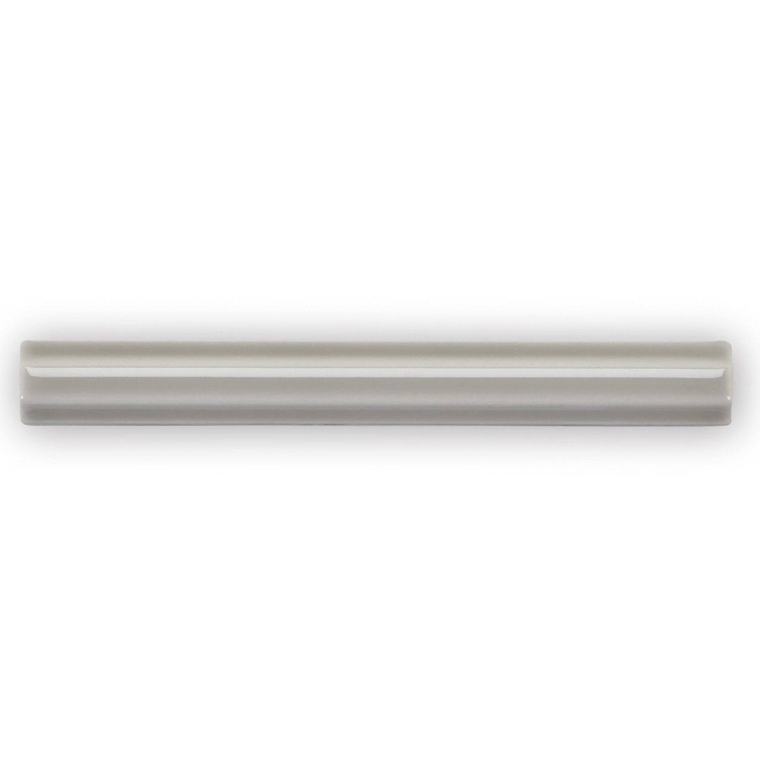 A sleek matte gray ceramic tile giralda niebla grey pencil with subtle glossy finish and two parallel grooves