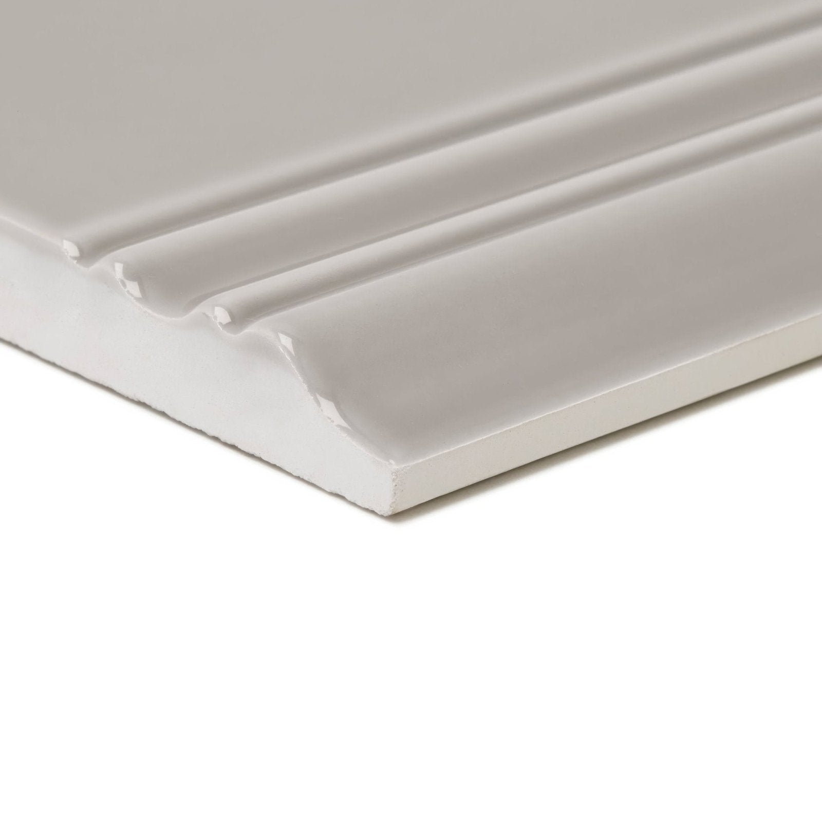 White ceramic giralda niebla grey skirting with glossy finish and three parallel grooves for elegant wall edging