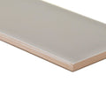A sleek matte-finished beige giralda niebla grey tile with subtle glossy sheen on its rectangular surface