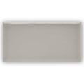 Giralda Niebla grey tile is a sleek rectangular ceramic tile with a smooth matte gray finish and subtle glossy edges
