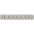Giralda Niebla Grey Trim sleek off-white ceramic tile strip with embossed five-petaled floral pattern and central dots