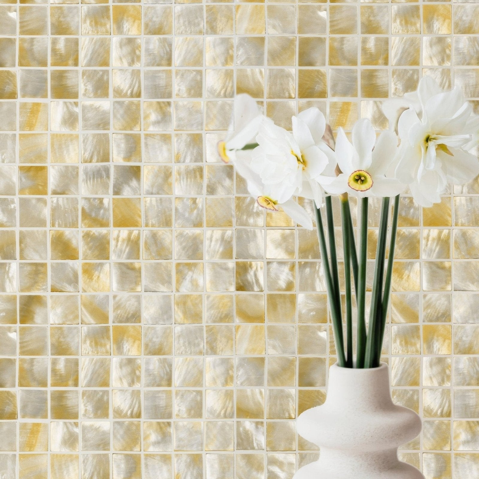 White ceramic vase with white daffodils and yellow centers against golden cream mosaic tiles in golden promise 25mm square