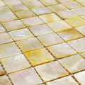 Golden promise 25mm square iridescent yellow and cream mother of pearl mosaic tiles with a glossy finish