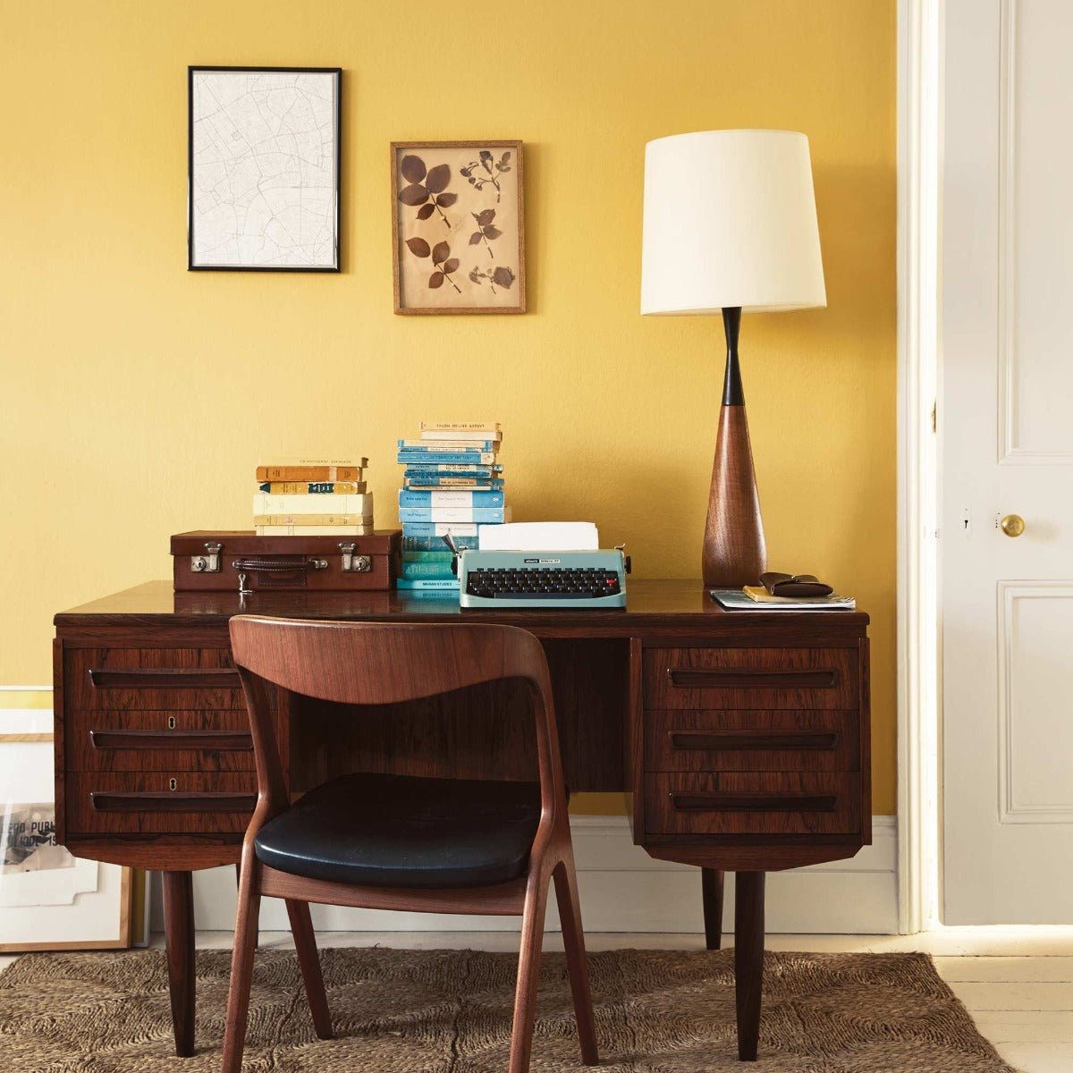 Goldfinch teak wood desk with matching chair and vintage turquoise typewriter for stylish workspace setup