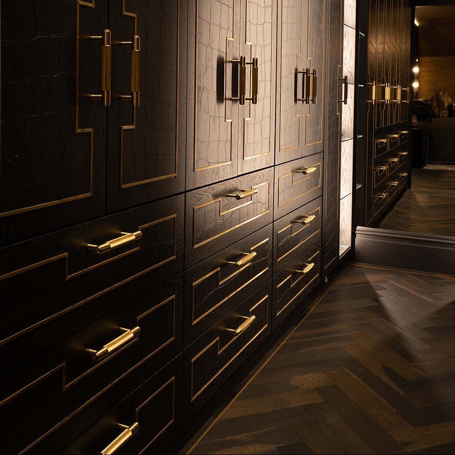 Goodrich charred oak black lacquered cabinets with gold geometric hardware and subtle crocodile skin texture