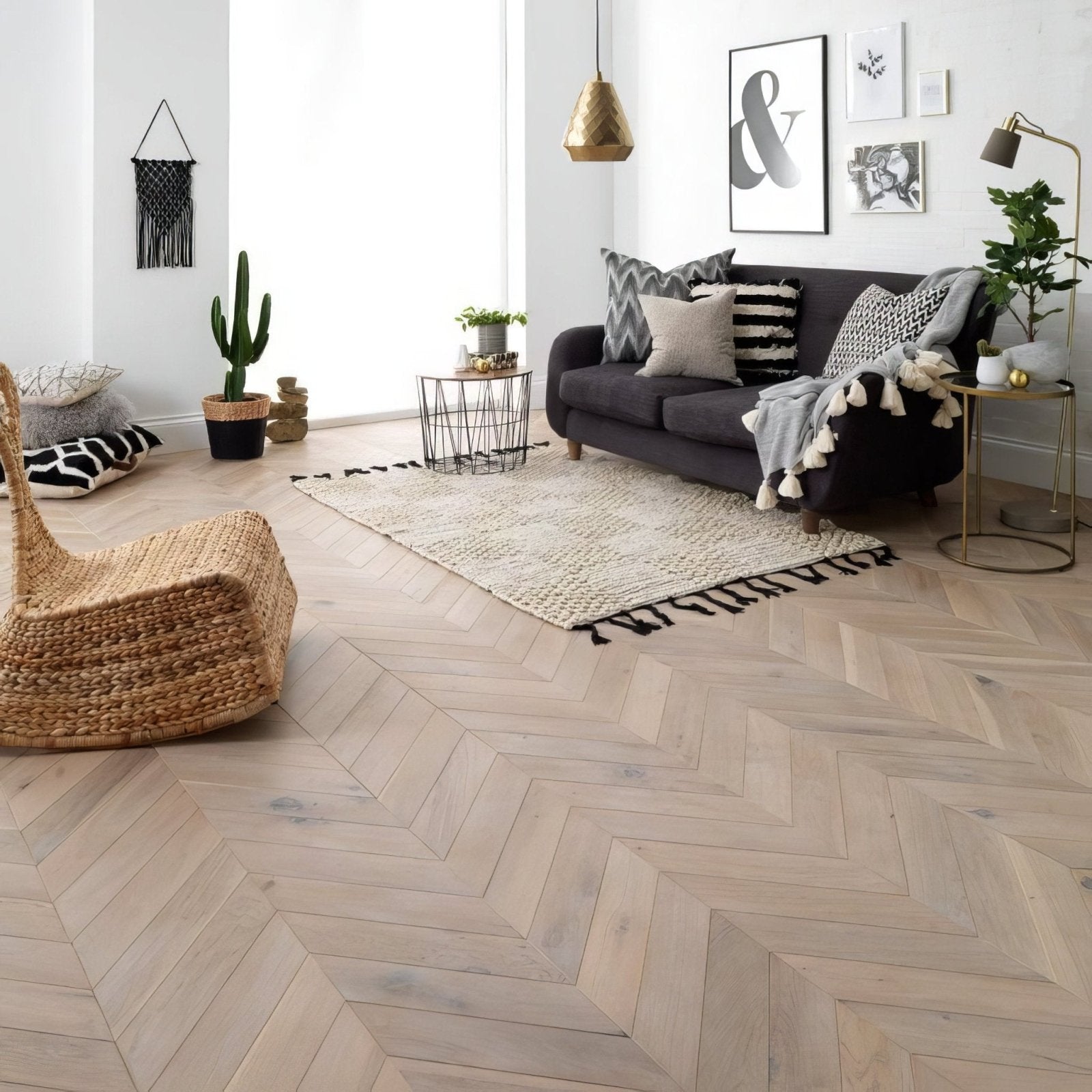 Goodrich Feather Oak Chevron light gray wood flooring in a herringbone pattern made from oak material
