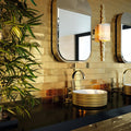 Grace 30 x 30cm gold ceramic mosaic tiles behind a gold-rimmed stacked vessel sink