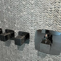 Gravity Aluminium Arrow Metal Mosaic grey chevron aluminium mosaic with a black chrome shower tap