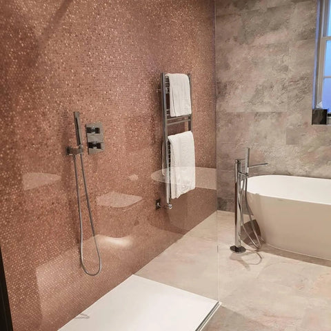 Gravity Aluminium Hexagon Rose Gold Mosaic rose gold hexagon aluminium mosaic walls with chrome fixtures and a freestanding bathtub