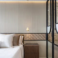 Gravity Aluminium Shell Gold Mosaic gold fish-scale aluminium mosaic feature in a bedroom with wood panelling