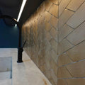 Gravity Aluminium Trace Gold Mosaic gold chevron aluminium mosaic with a black aluminium tap on a marble countertop