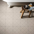 Beige and gray geometric patterned bathroom floor tiles in greenway grey on chalk style