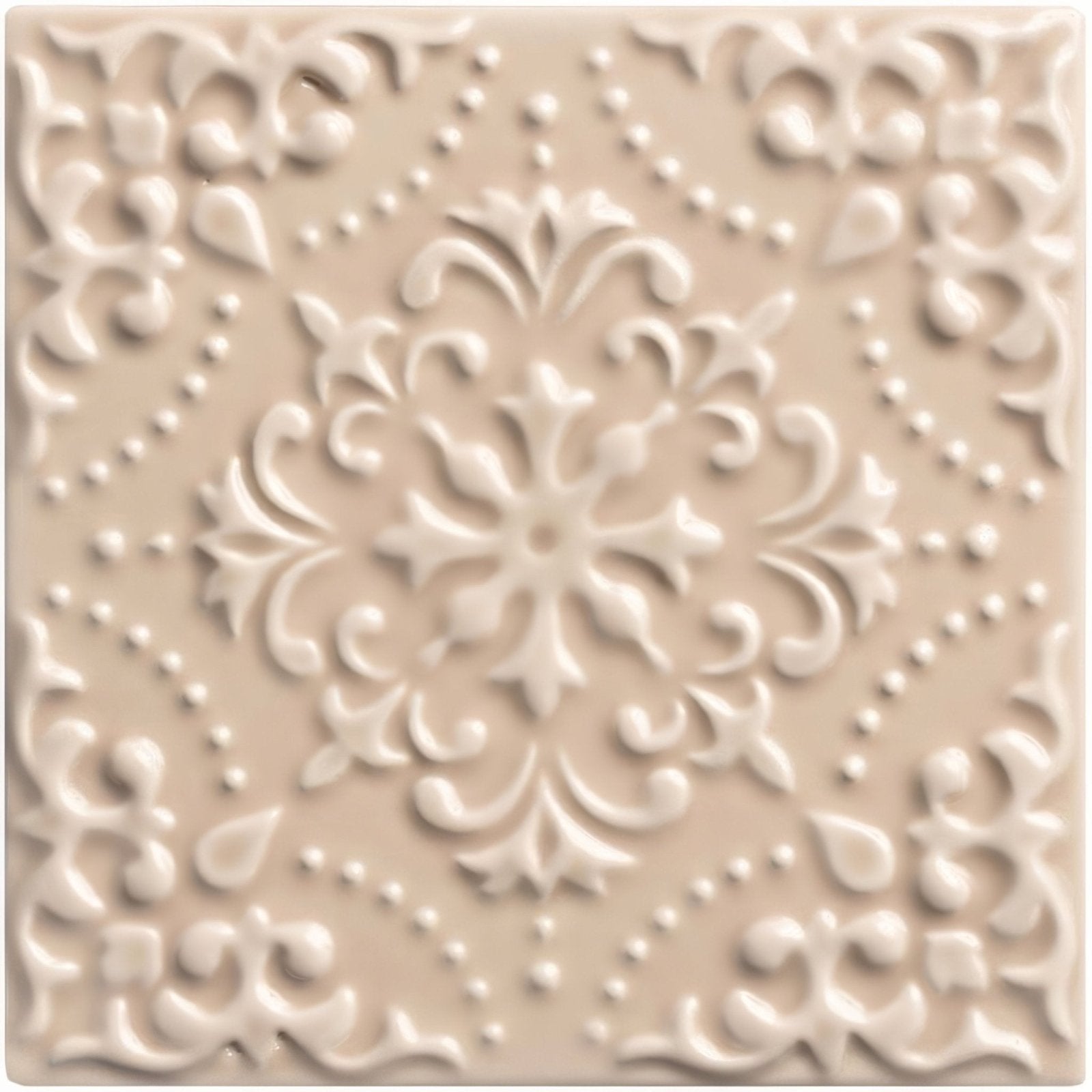 Beige ceramic tile hadleigh highgrove with raised ornate floral and scrollwork design for decorative use