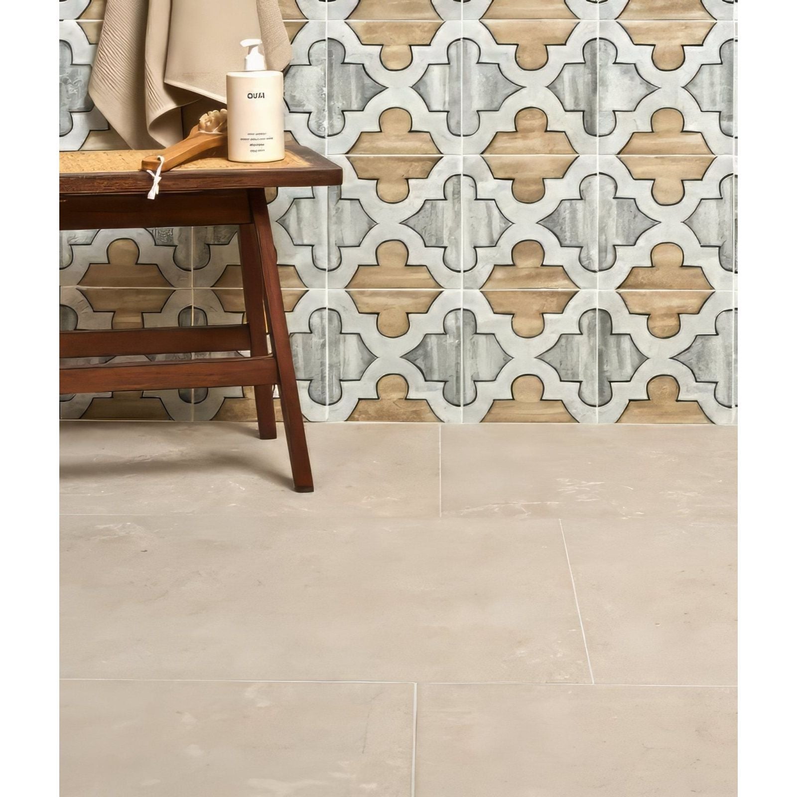 Wychwood limestone velvet finish ceramic tile in cream with a geometric quatrefoil pattern in gray and beige tones