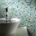 Hammered Pearl Aqua Glass Mosaic blue, teal and cream glass mosaic behind a white sink with a chrome tap
