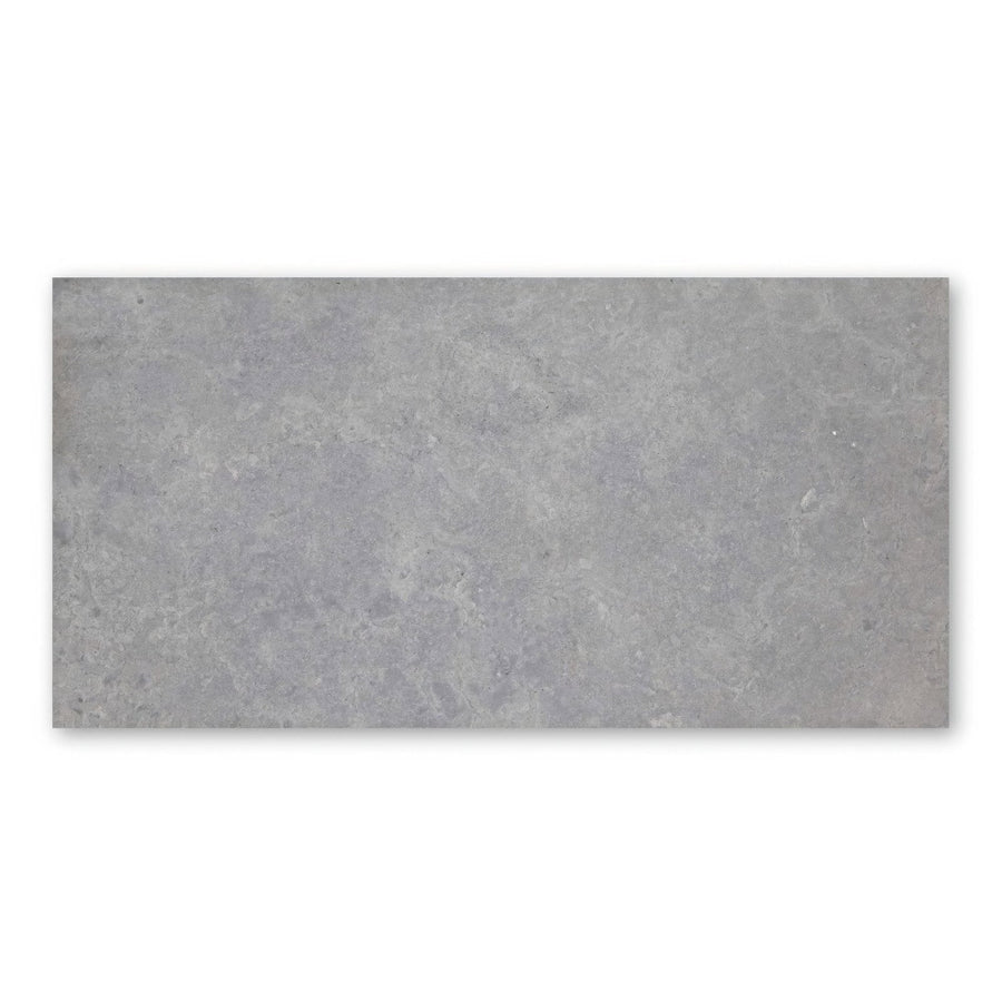 Gray rectangular tile with a textured concrete-like surface hampton bays 60 x 30cm honed finish