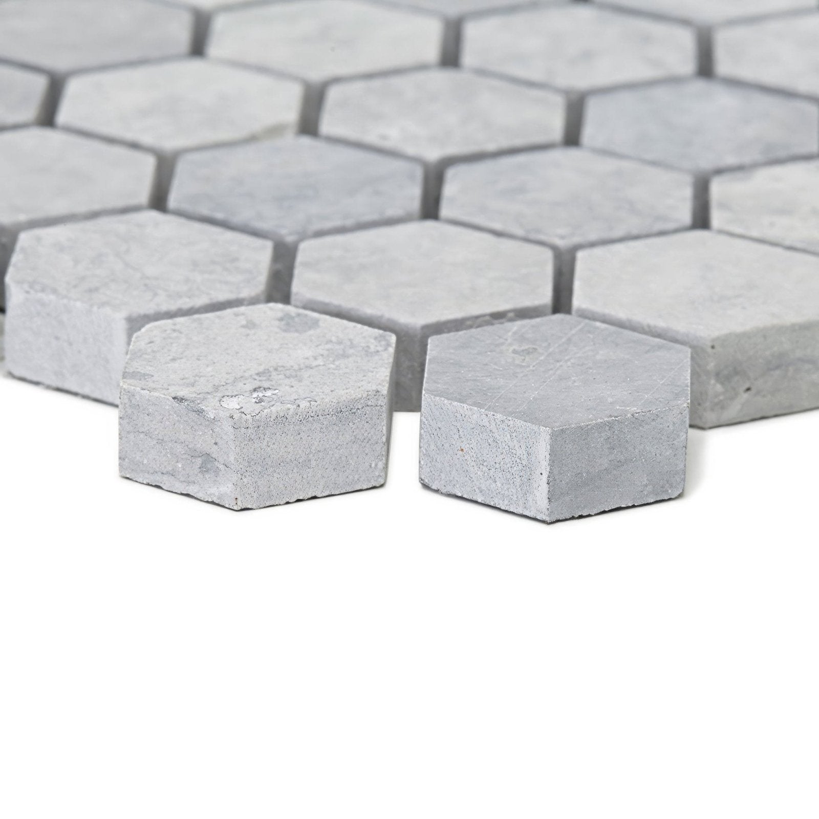 Light gray hexagonal marble mosaic tiles with subtle veining in the hampton bays hexagon mosaic design