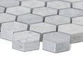 Light gray hexagonal marble mosaic tiles with subtle veining in the hampton bays hexagon mosaic design