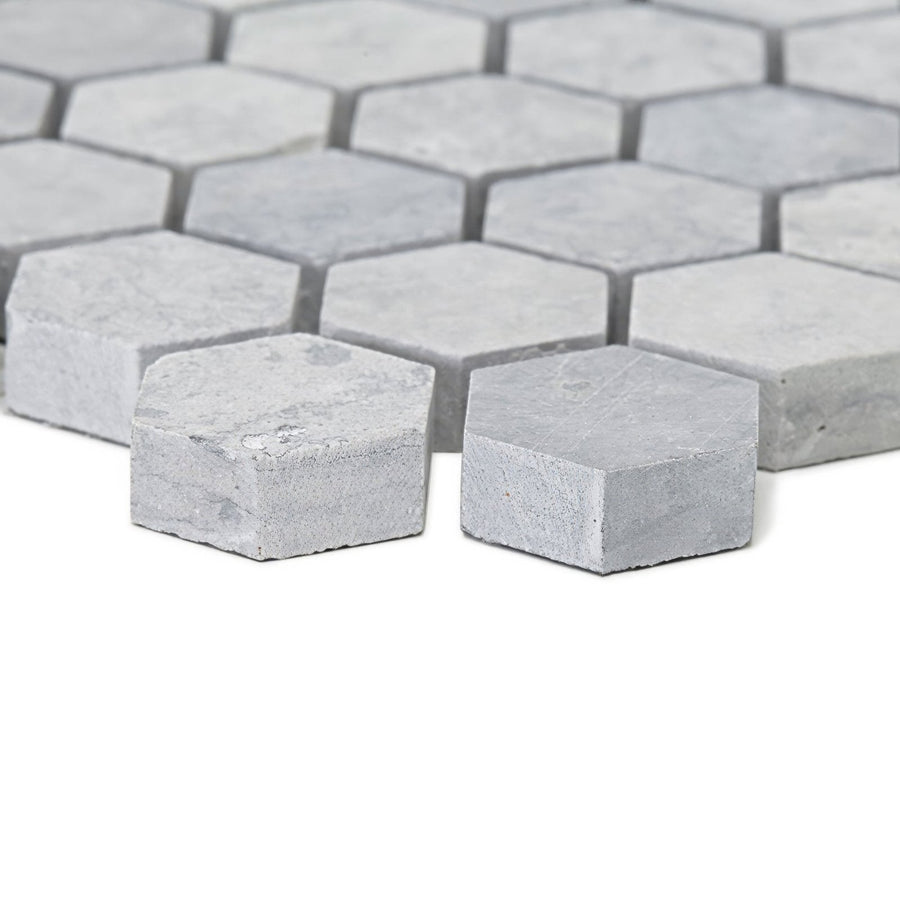 Light gray hexagonal marble mosaic tiles with subtle veining in the hampton bays hexagon mosaic design