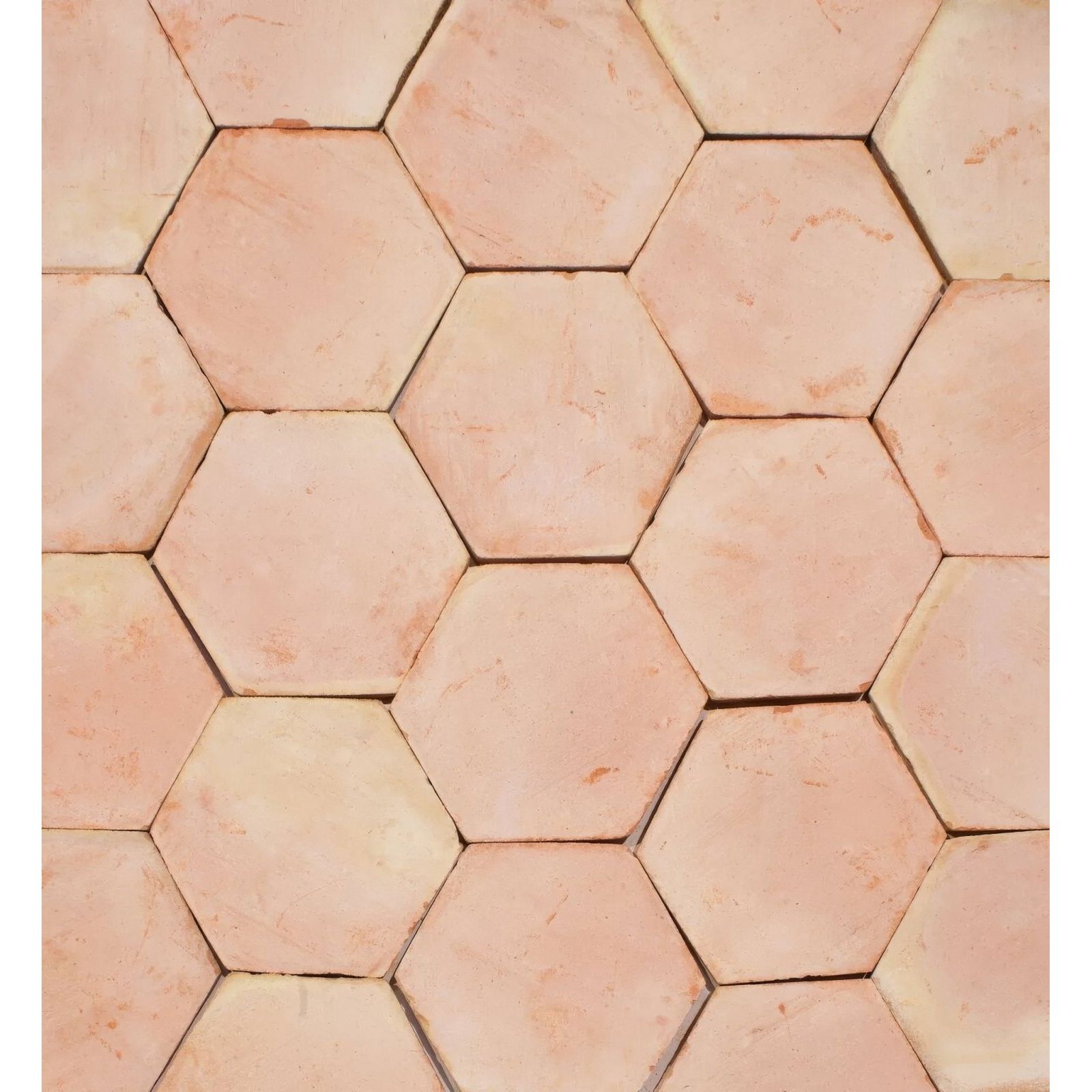 Handmade classic terracotta hexagonal floor tile in warm earthy tones with subtle natural color variations