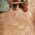 Handmade classic terracotta hexagonal tile with warm earthy tones and subtle color variations for flooring