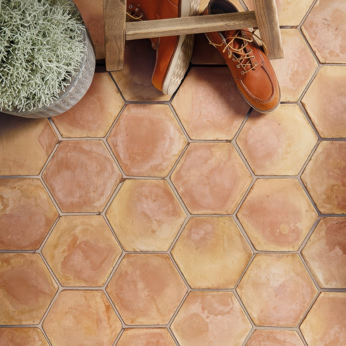 Handmade classic terracotta hexagonal tile with warm earthy tones and subtle color variations for flooring