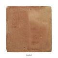 Handmade classic terracotta square tile 20 x 20cm in earth tones with a slightly rough texture and reddish-brown hues