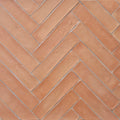 Handmade terracotta parquet rectangular tiles in terracotta color arranged in a herringbone pattern 30 x 7.5cm