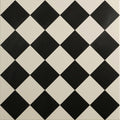 Harlequin small black on chalk black and white diamond patterned ceramic tile for walls and floors