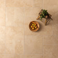 Hartland Abbey 600 x 600mm beige stone-effect floor tile with subtle marbled texture and natural veining