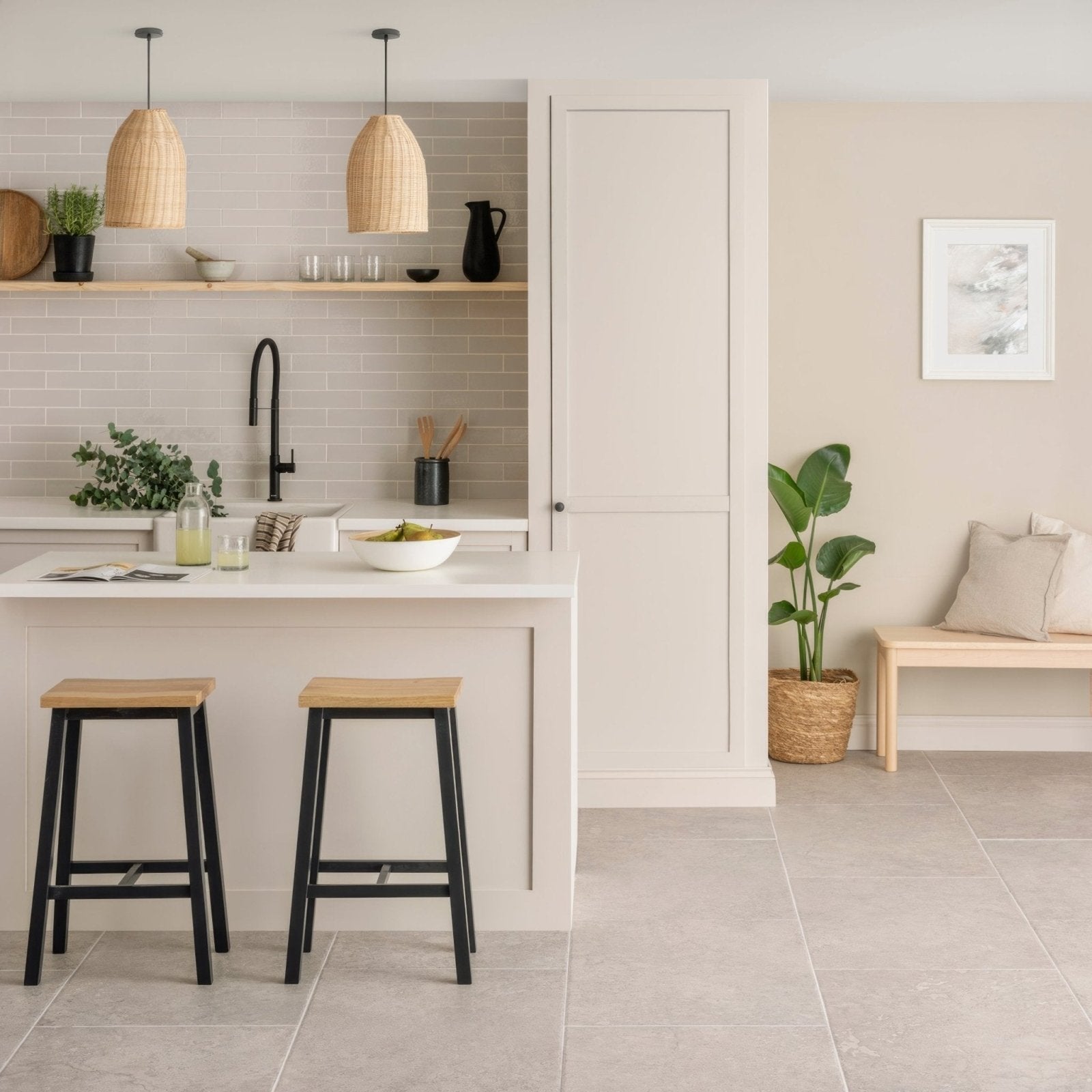 White kitchen island hartland chapel 900 x 600mm with smooth countertop and two black framed wooden stools in front