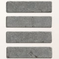 Four rectangular gray hazlebury limestone tumbled and etched klinkers with textured natural surface and tone variations