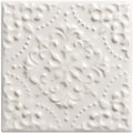 White textured wall tile helmingham highgrove with raised floral and dot patterns for decorative interior use