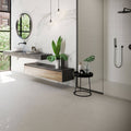 Helsinki 1841 Blanco white porcelain floor tiles with a floating black and wood vanity