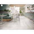Helsinki 1841 Blanco Decor Garden white patterned porcelain tiles in a herringbone layout